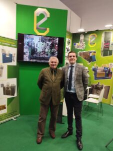 K2022, C2, Rubber machinery, team, booth, green, tables, people